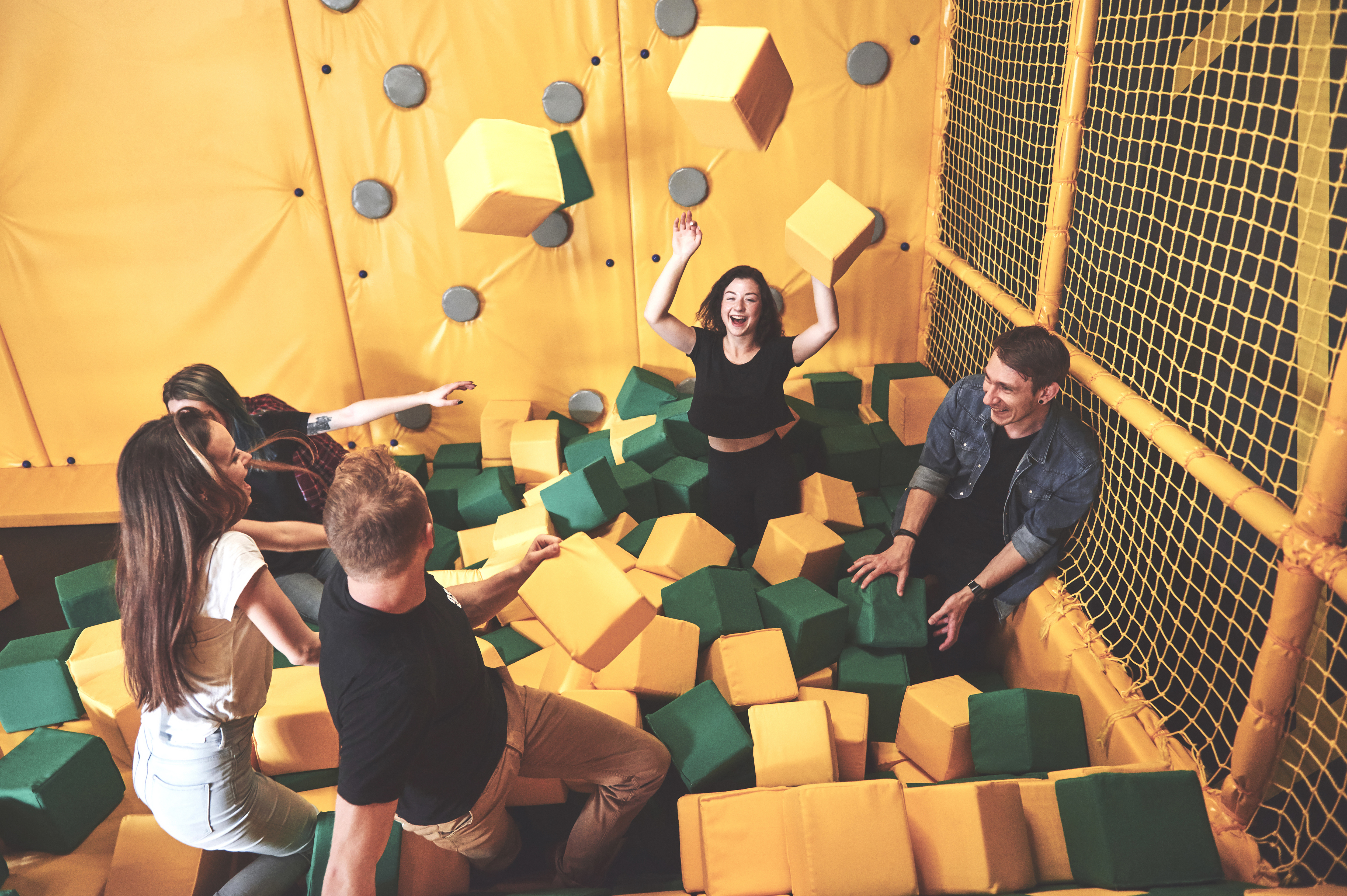 Families at an indoor entertainment venue